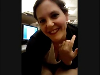 Bored nomination MILF masterbates in her cubicle.